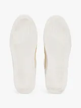 Zapatillas urbanas Tommy Hilfiger de corte bajo, color blanco con detalles en beige y amarillo. Presentan el logo de la marca en el lateral y están confeccionadas en piel, nailon y poliuretano.