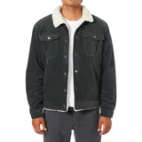 Campera de pana color negro con cuello y forro interior de borrego sintético. Presenta cierre frontal con botones metálicos, bolsillos de parche con solapa en el pecho y bolsillos laterales ribeteados.