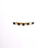 Broche dorado vintage con cinco apliques de resina negra.