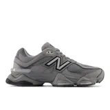 Championes urbanos New Balance modelo U9060ZGB, color gris con detalles en negro y blanco, confeccionados en gamuza y malla, con logo "N" característico en los laterales y entresuela con amortiguación ABZORB y SBS.