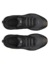 Championes de entrenamiento Under Armour modelo Charged Commit TR 5, color negro con detalles en beige en la suela. Presentan parte superior de malla transpirable con revestimientos de cuero, entresuela Charged Cushioning para absorción de impactos y suela de goma con refuerzos laterales.