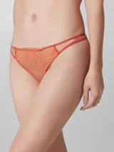 Colaless de encaje color naranja quemado con diseño floral. Presenta bordes finos y cintura elástica con tiras delgadas a los costados.