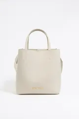 Bolso tote Bimba y Lola modelo Chihuahua, color beige, con doble asa corta y correa larga extraíble con logo de la marca.