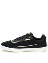 Sneaker Caterpillar modelo Pause Retro T-Toe para mujer, en color negro con detalles dorados y suela blanca. Fabricadas en cuero gamuzado, cuentan con plantilla de espuma EVA y suela de goma duradera.