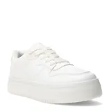 Championes urbanos de plataforma Miss Carol, color blanco, con diseño acordonado y suela gruesa.