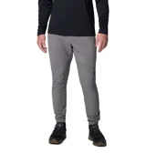 Pantalón técnico Columbia de corte ajustado en color gris, con cintura elástica ajustable mediante cordón y puños elásticos en los tobillos. Presenta paneles reforzados en la parte superior y bolsillos laterales y traseros con cierre.