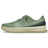 Championes Crocs Inmotion Heel Block Pacer color verde militar, con detalles en negro en el talón y suela beige. Incorporan tecnologías LiteRide y Free Feel Technology, con parte superior perforada, cordones elásticos y diseño deportivo.
