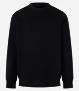 Sweater color beige de algodón y poliéster, de corte holgado, cuello redondo y mangas largas.