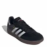 Championes Adidas Samba de mujer, color negro con las tres franjas características en plateado, puntera de ante y suela de goma translúcida.