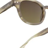 Lentes de sol Izipizi modelo Sun C, con montura redonda color marrón con diseño carey y lentes marrones.