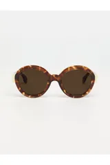 Lentes de sol con armazón redondo de acetato con estampado carey en tonos marrones y beige, y cristales oscuros.