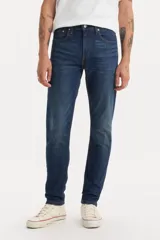 Jean Levi's modelo 512 Slim Taper de corte ajustado, con diseño de pierna cónica que se estrecha desde la rodilla hasta el tobillo. Confeccionado en denim elástico de tiro medio con cierre de bragueta.