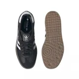 Championes Adidas modelo Sambae, color negro con las icónicas tres tiras blancas laterales y suela de plataforma de goma color caramelo. Presenta detalles en blanco en el talón y el logo de la marca en la lengüeta.