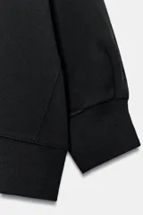 Sudadera crop de algodón con cuello redondo y mangas cortas abullonadas con puños ajustados.