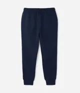 Pantalón deportivo de corte jogger, color negro, con cintura elástica ajustable mediante cordón, bolsillos laterales y puños acanalados en los tobillos. Confeccionado en tejido de algodón con interior felpudo.