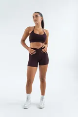 Top deportivo de tejido acanalado en color azul marino, con diseño de espalda estilo nadador y breteles finos regulables.