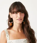 Musculosa blanca de algodón con estampado de palmeras, escote cuadrado y tirantes anchos contrastantes.