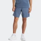 Short deportivo Reebok Workout Ready Woven, color azul, con cintura elástica y cordón ajustable.