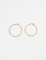 Aros de acero quirúrgico hipoalergénico, estilo argolla, color dorado y tamaño extra grande.