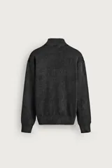 Chaqueta de punto relaxed fit de algodón color gris oscuro con efecto lavado, cuello subido, manga larga y cierre frontal con cremallera.