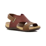 Sandalia casual de mujer con dos tiras y pulsera al tobillo con cierre ajustable. Presenta capellada de cuero negro, plantilla acolchada y suela tipo corcho con base marrón antideslizante.
