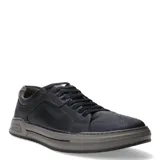 Championes urbanos Democrata modelo Nosu, color azul marino con detalles en marrón tabaco. Presentan un diseño acordonado con costuras reforzadas, suela de goma gris con logo grabado en el lateral y acabado en cuero.