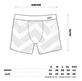 Boxer de lycra premium con estampado floral con hojas y flores tropicales en tonos amarillos, naranjas y verdes sobre fondo negro. Cintura elástica negra con logo Rufián.