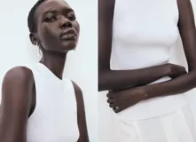 Top de punto canalé color blanco, de diseño entallado con cuello redondo y tirantes anchos sin mangas.