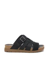 Sandalias negras de gamuza sintética con textura animal print de serpiente, capellada con tiras cruzadas, hebilla metálica de ajuste lateral y suela de goma con plataforma de corcho.