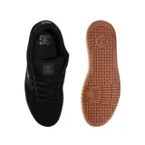Championes de skate DC modelo Manteca 4, color negro con suela de goma color caramelo. Diseño robusto con paneles de gamuza y cuero sintético, logo de la marca en el lateral y lengüeta acolchada.