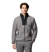 Campera de polar gris con cierre frontal completo y cuello alto. Presenta un panel frontal superior en color negro, bolsillos laterales con cierre y logo de la marca bordado en el pecho.