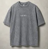 Remera oversize de algodón con efecto stone wash gris, de manga corta y cuello redondo, con estampado en serigrafía en la espalda que dice "Mentality".