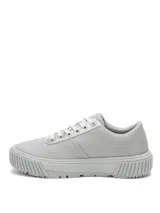 Sneaker Cat modelo Amp Canvas, color gris, con plataforma de 5 cm y suela de goma con tracción. Presenta capellada de canvas con detalles en material sintético metalizado en la zona de los cordones y logo de la marca grabado en el lateral.