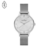 Reloj Skagen modelo Anita Lille con caja de acero plateado de 30mm, esfera plateada con números 12 y 6 y cristales en los demás marcadores, y malla metálica plateada.