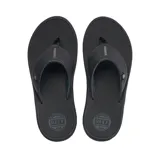 Ojotas Reef modelo Phantom Nias de color negro, con tiras anchas sintéticas, suela texturizada y detalle de logo metálico en la tira.