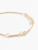 Pulsera dorada con cadena fina y apliques de strass.