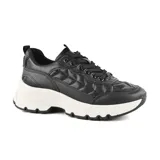 Championes negros de cuero sintético con diseño acolchado y suela chunky blanca.