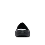 Sandalia tipo slide Columbia modelo Thrive Revive, color negro, diseñada para recuperación con entresuela de espuma ligera y suave. Presenta aberturas laterales para ventilación, plantilla hexagonal texturizada y suela de alta tracción para condiciones húmedas y secas.