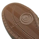 Championes de skate Adidas modelo Tyshawn II, color verde oliva, confeccionados en una combinación de cuero y gamuza, con las icónicas tres tiras laterales y suela de goma resistente.