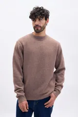 Buzo de tejido de punto con cuello redondo, mangas largas y puños acanalados, en color taupe.