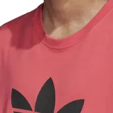 Remera rosa de corte clásico con logo Adidas en el frente que incluye el trébol y un diseño de un lagarto con anteojos.