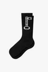 Medias negras de caña alta con diseño estampado de una llave grande en color blanco.