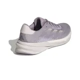 Championes de running Adidas Supernova Stride, color lila con detalles plateados y suela blanca.