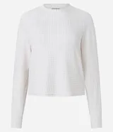 Blusa de pijama de manga larga con cuello redondo, confeccionada en tejido rib con estampado de cuadros en tonos claros.