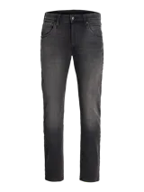 Jean tapered de hombre color negro con acabado lavado, tiro bajo y diseño clásico de cinco bolsillos.