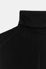 Jersey de punto con lana, de cuello subido y manga larga. Presenta un diseño ajustado con detalle de costuras verticales marcadas en el frente.