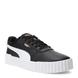 Championes Puma Carina 3.0 de estilo urbano, color negro con detalles en blanco. Presentan una suela de plataforma texturizada, cierre con cordones y el logo de la marca en dorado en el lateral y la lengüeta.