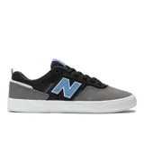 Championes urbanos New Balance modelo 306, con capellada de gamuza gris, detalles en negro y celeste, logo "N" característico en los laterales y suela blanca de goma vulcanizada.