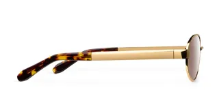 Lentes de sol con montura ovalada de acero inoxidable en color dorado y cristales polarizados en tono marrón. Presentan un diseño de puente fino y patillas con terminación en carey.