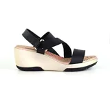 Sandalias con plataforma Korium Confort de tiras cruzadas negras y plataforma blanca.